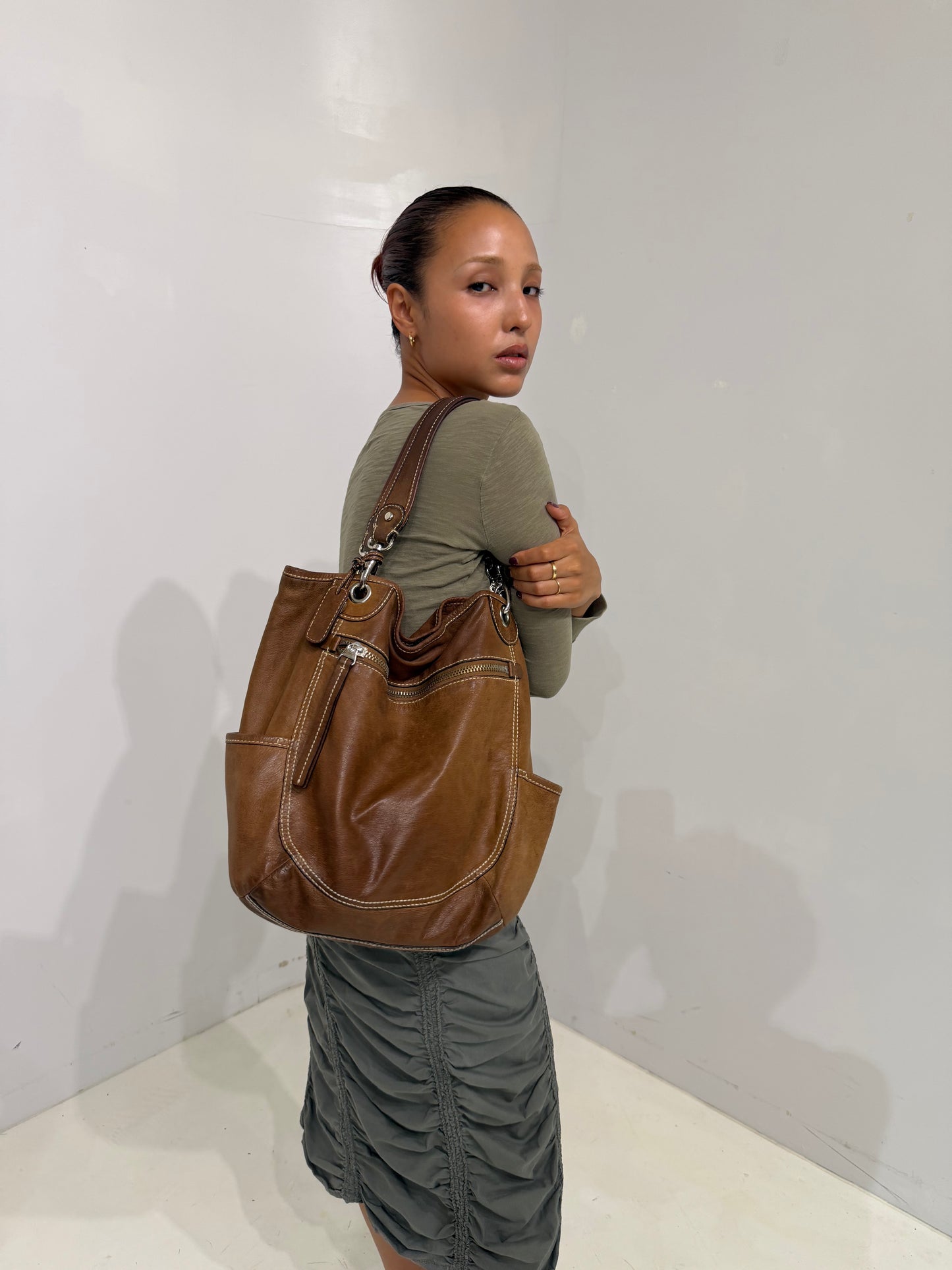 brownleather white stitched shoulder bag