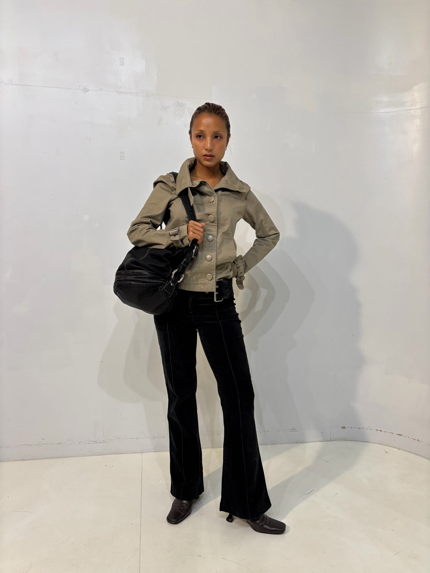 belted low-waisted flared black corduroy pants