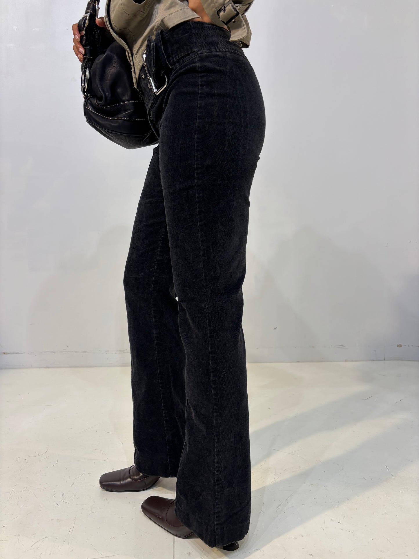 belted low-waisted flared black corduroy pants
