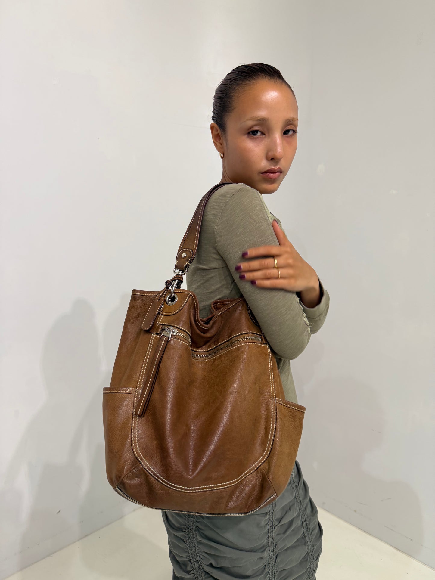 brownleather white stitched shoulder bag