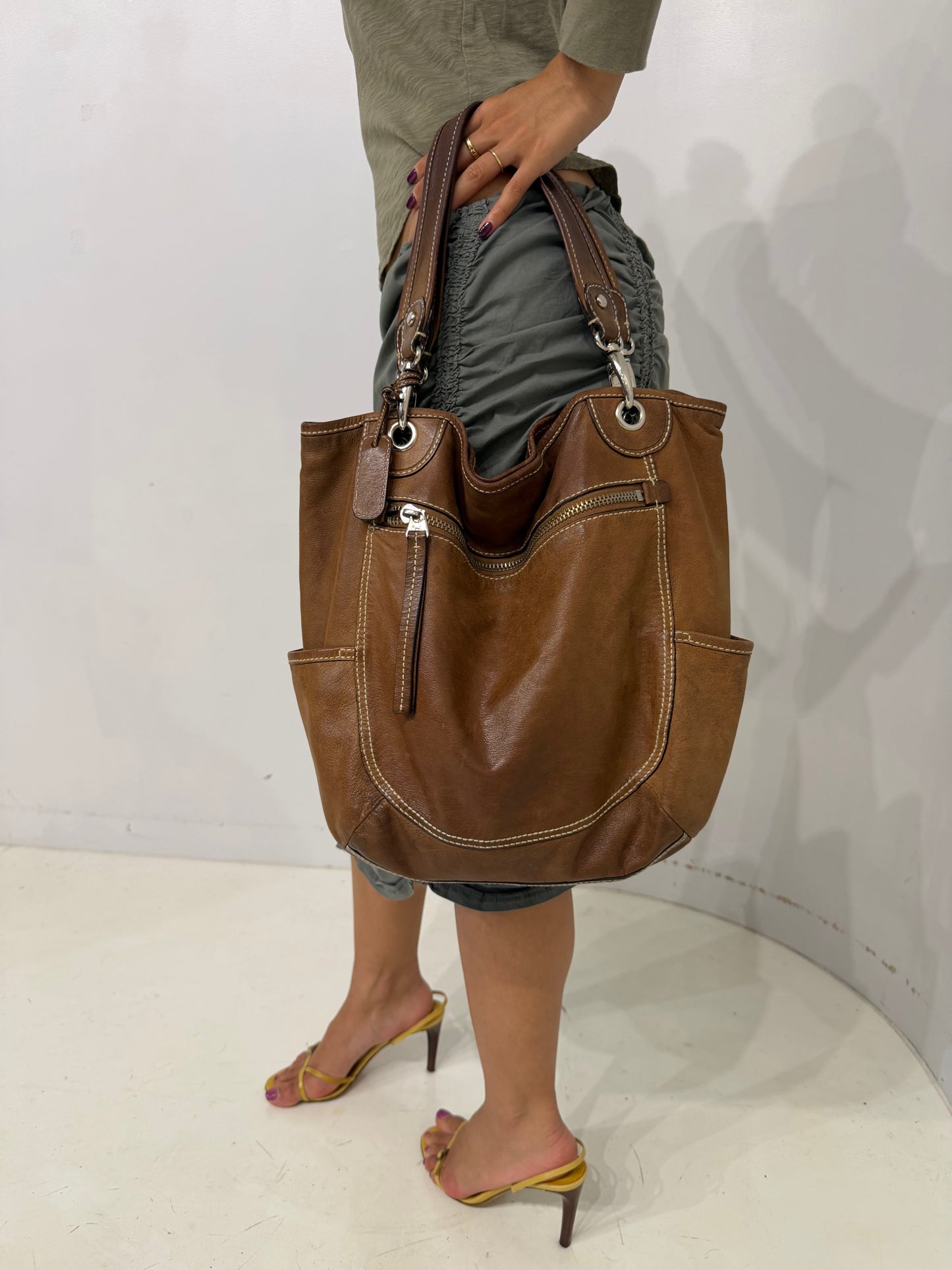 brownleather white stitched shoulder bag