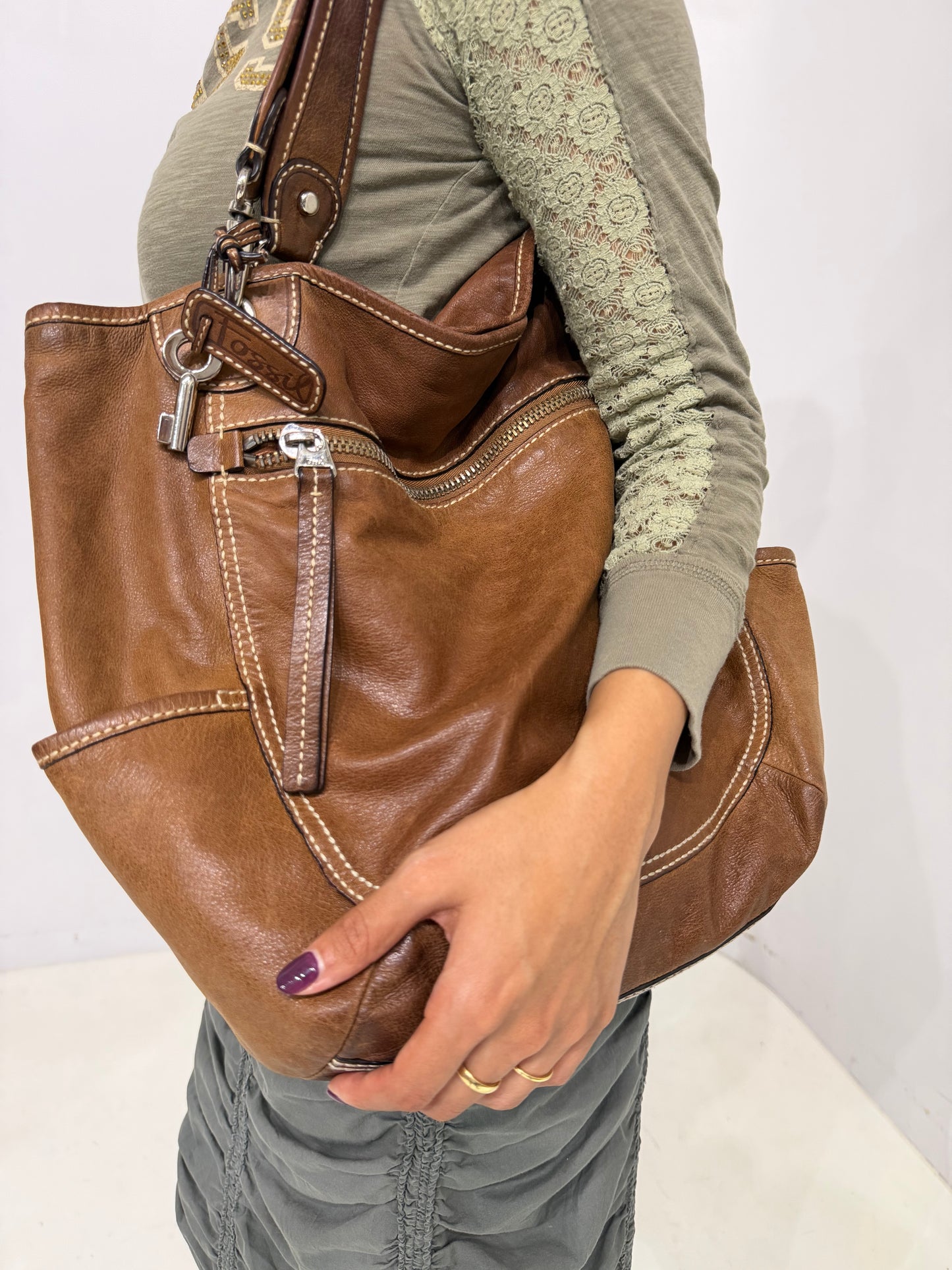 brownleather white stitched shoulder bag